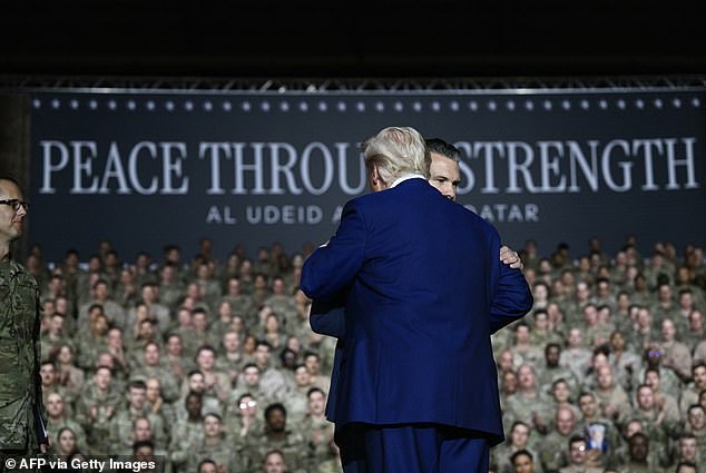 President Trump hugs Defense Secretary Pete Hegseth, who introduced him