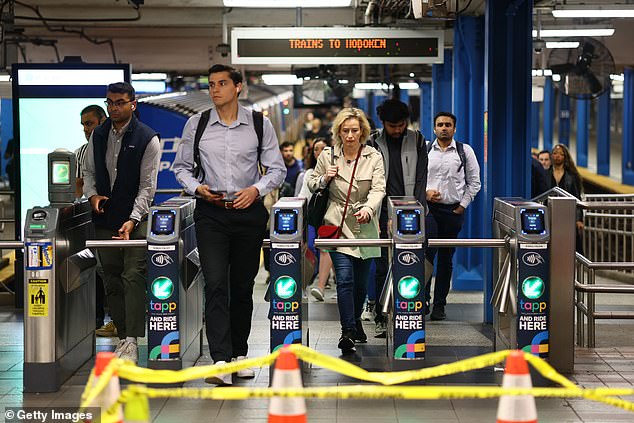 People exit the 33rd Street Path Transit line on May 16, 2025 in New York City as about 450 members of the Brotherhood of Locomotive Engineers and Trainmen are on strike