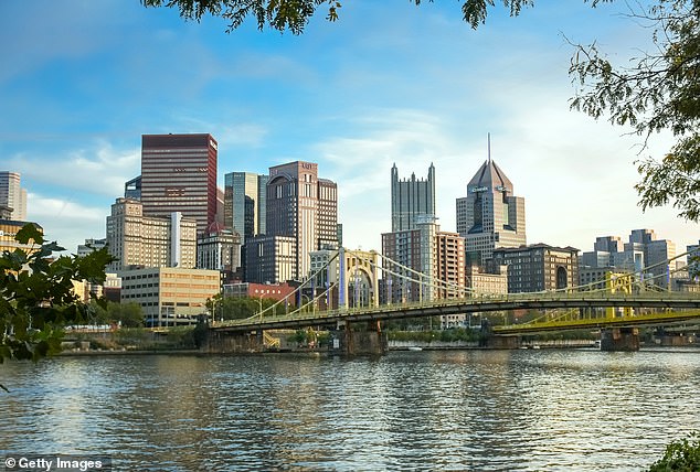 Pittsburgh skyline featuring its famous 'Rachel Carson bridge', several skyscrapers and Allegheny river waterfront