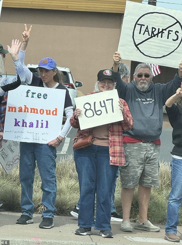 A protestor gleefully holds a sign reading '86 47' at a rally for detained student Mahmoud Khalil earlier this year
