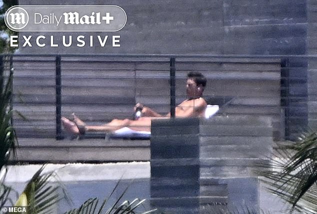 Brady enjoyed a refreshing drink during his nude sunbathing session