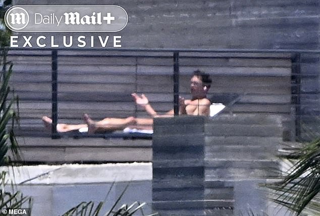 Brady looked animated as he took an apparent phone call during his sunbathing day