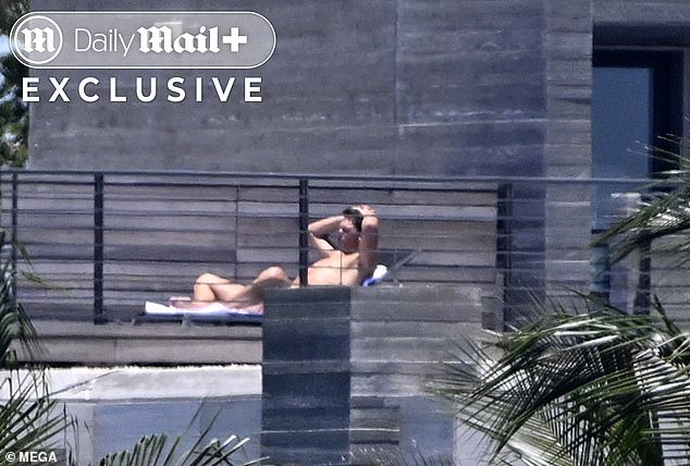 Brady bared all on the rooftop, covering his modesty with a towel
