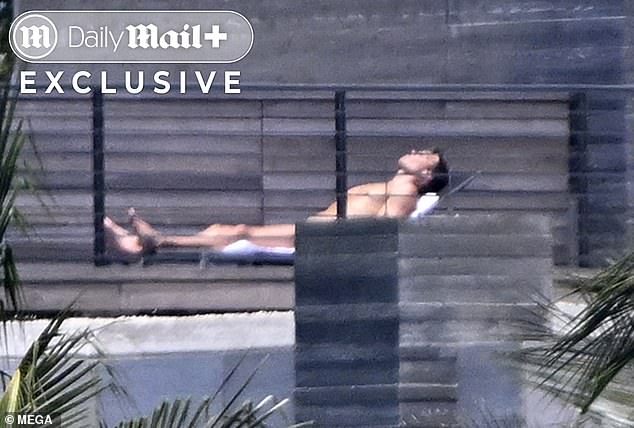 A nude Brady enjoyed a moment of quiet contemplation on his rooftop