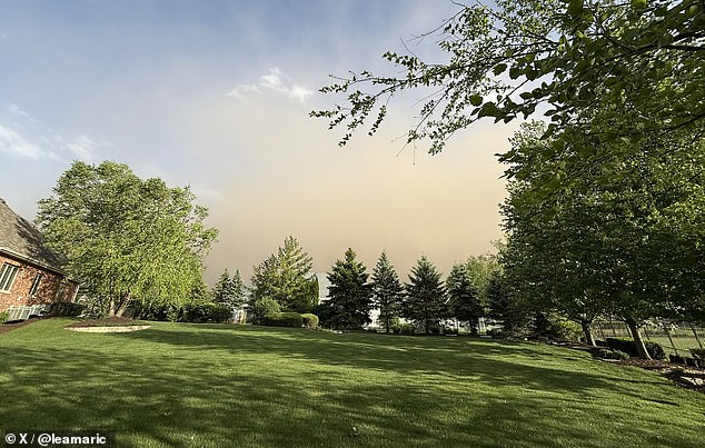 A ground stop was issued earlier in the evening at O'Hare International Airport as the storm system pummeled the city. Pictured: A wall of dust approaches the Illinois suburbs