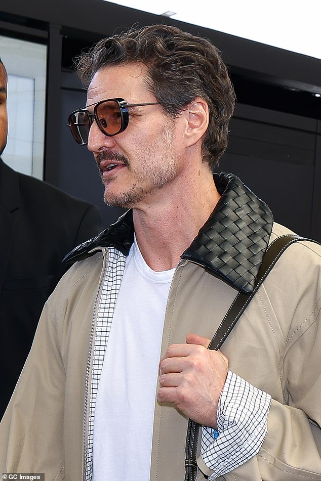 The Last of Us star cut a casual figure as he made his way through the airport, but it was his sharp jaw that had the attention of fans