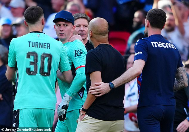 He was eventually ushered away by Palace reserve goalkeeper Matt Turner (left) after the duo exchanged words