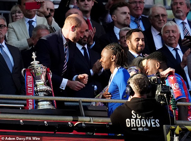He received the biggest cheer of all from fans as he collected his medal from Prince William