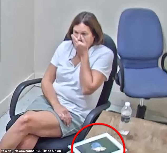 After being shown a picture of the remains, circled here, Mazzuca recoils at the image