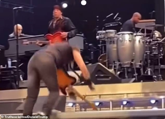 A superimposed golf ball appears to strike Springsteen in the back, making it look like Trump¿s swing sent him tumbling