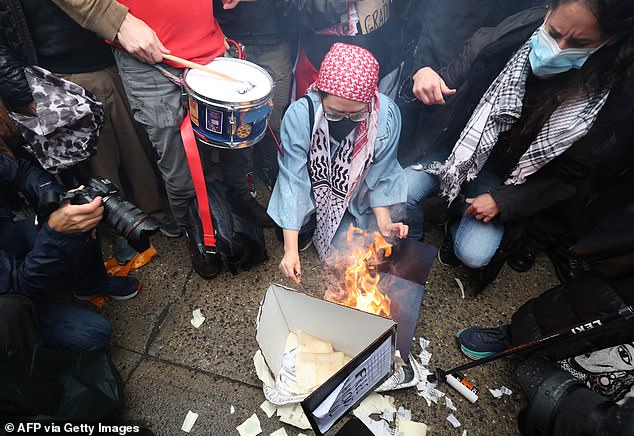 Pictured: An image of diplomas burning on Wednesday