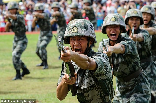 File photo. PLA soldiers shout during a demonstration in Hong Kong on July 1, 2016