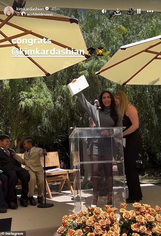Kim received her diploma from her mentors, who raved about her achievements