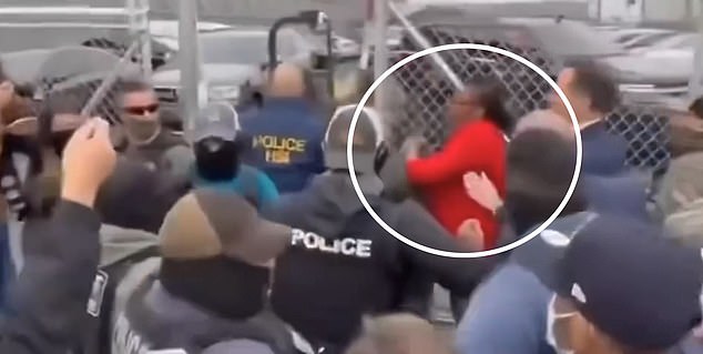 Congresswoman LaMonica McIver (circled in red) got into a heated clash with law enforcement officers outside Newark ICE center Delaney Hall as he was apprehended