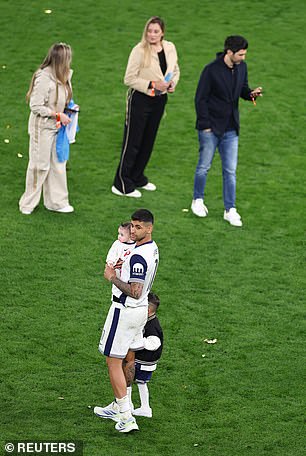 Romero was seen with his two children on the pitch