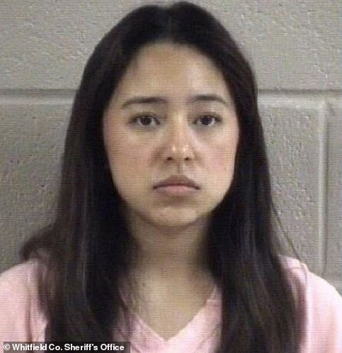 On May 5, the college student's life took a dramatic turn when her dark gray truck was mistaken for a black pickup that had turned right on a red light located in front of a sign reading 'no turn on red'
