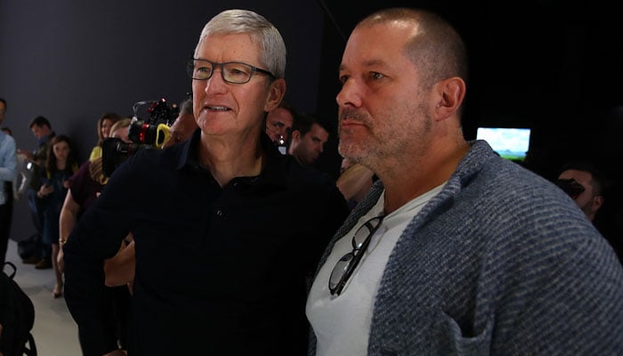 Apple CEO Tim Cook (left) and Apple design chief Jony Ive look at the new Mac Pro during the 2019 Apple Worldwide Developer Conference (WWDC) at the San Jose Convention Center in San Jose, California on June 3, 2019. — VCG