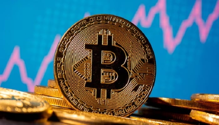 A representation of virtual currency bitcoin is seen in front of a stock graph in this illustration taken November 19, 2020.— Reuters