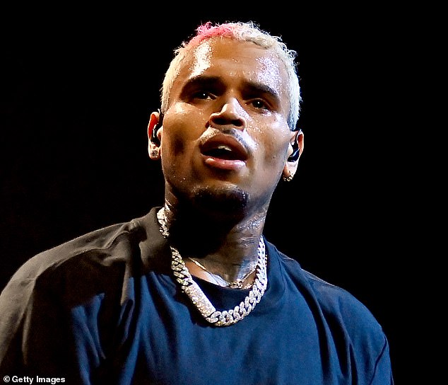 Chris Brown has been arrested in Manchester over a bottle attack at a London nightclubttack