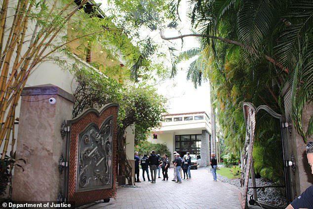 Diddy's Miami mansion is seen during a March 2024 Homeland Security raid which saw its gates busted down by an armored vehicle