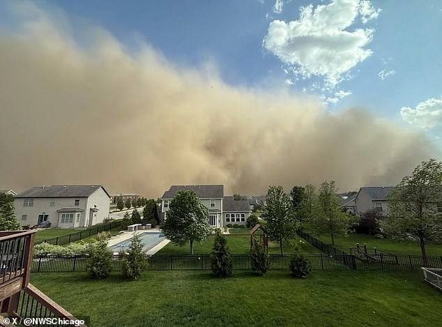 A wall of dust descended upon Chicago late Friday afternoon, casting the city into an eerie, apocalyptic haze as visibility plummeted to nearly zero