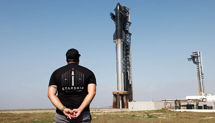 Matt Farrah of Newcastle, Australia views SpaceXs next-generation Starship spacecraft atop its Super Heavy booster is prepared for launch on its ninth test at the companys launch pad in Starbase, Texas, US, May 27, 2025. — Reuters