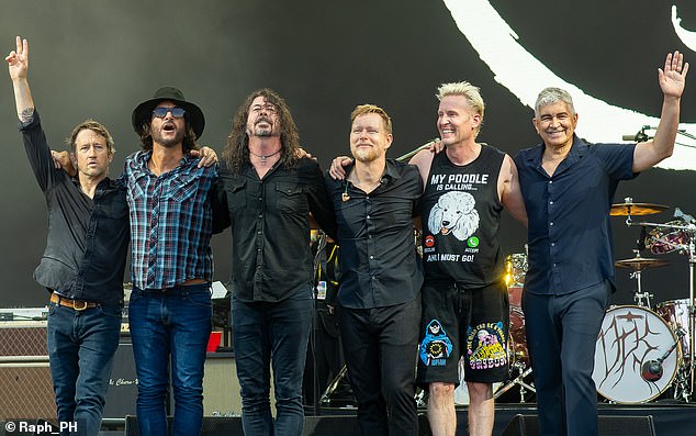 The Foo Fighters have fired a key band member in a shock decision eight months after Dave Grohl's affair rocked the group - pictured Chris Shiflett, Rami Jaffee, Dave Grohl, Nate Mendel, Josh Freese, and Pat Smear at Glastonbury in 2023