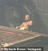 The American icon, 75, was seen stretched out on the balcony of a city centre hotel, making the most of the rare UK sunshine.