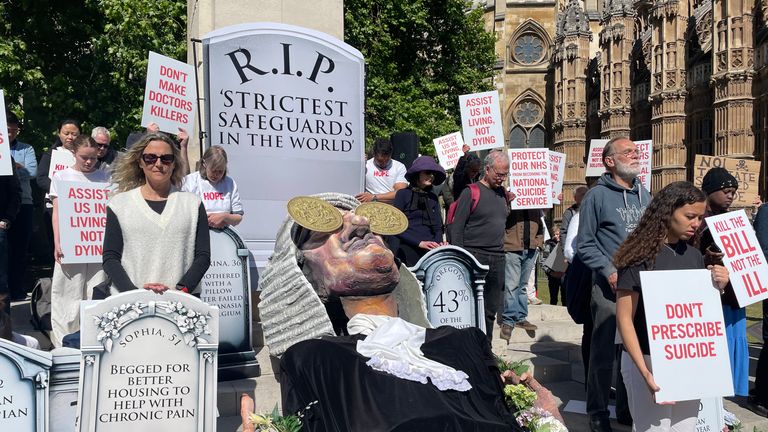 Campaigners opposing the assisted dying legislation demonstrate outside the Palace of Westminster.
Pic:PA