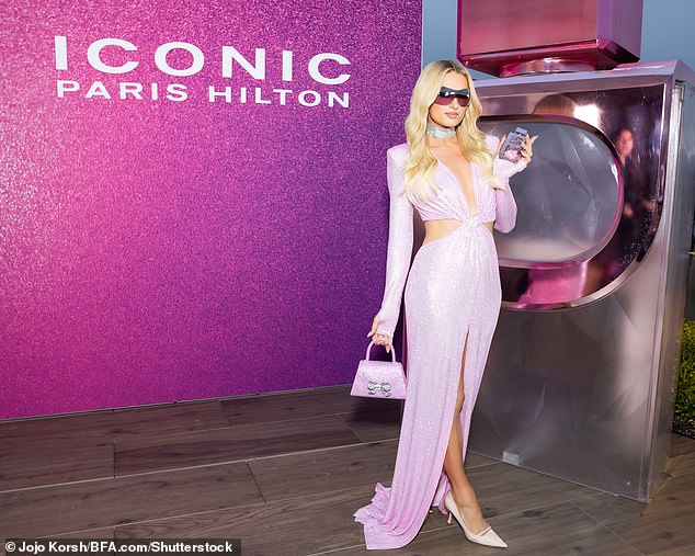 Paris looked nothing short of sensational for the event as she posed up a storm in a glittering pink maxi dress featuring cut out details