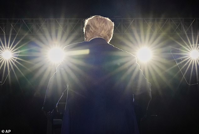 Donald Trump takes the stage at the Al Udeid Air Base in Qatar