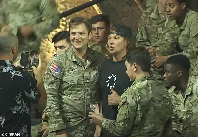 Podcaster and comedian Theo Von takes pictures with service members at Al-Udeid Air Base in Qatar