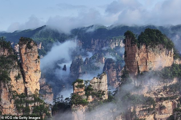Aerial view of the cloud-shrouded Zhangjiajie National Forest Park following rainfall on May 9, 2025