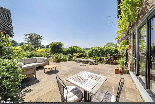Get talking: The outdoor space has multiple dining and relaxation areas
