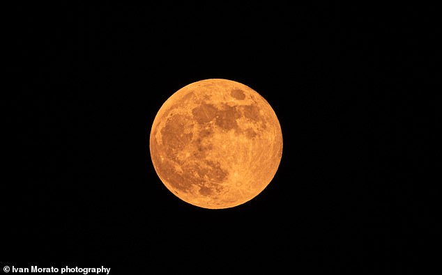 June full moon (Strawberry Moon) will be lower than usual this year due to an astronomical phenomenon called 'major lunar standstill'. Pictured, Strawberry Moon of 2020, as seen from Spain