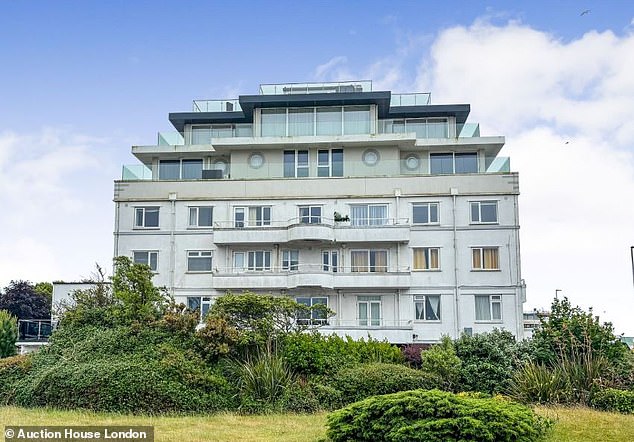 Good neighbours: The apartment is in this block, which is next to the exclusive Sandbanks