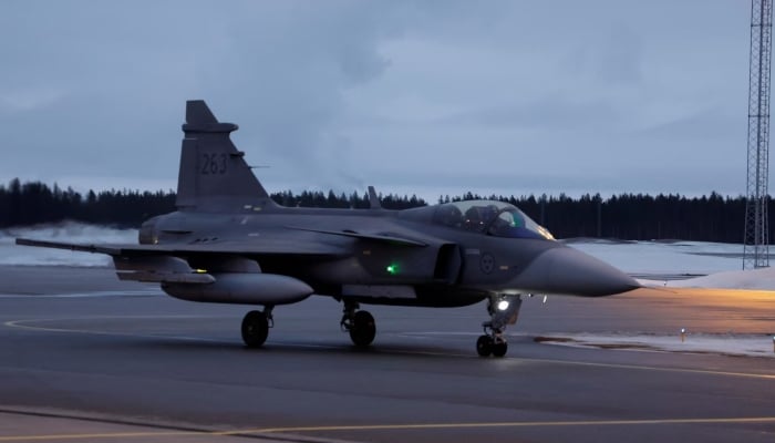 A Swedish JAS Gripen fighter jet arrives at Kallax Air Base, Sweden, March 4, 2024. — Reuters