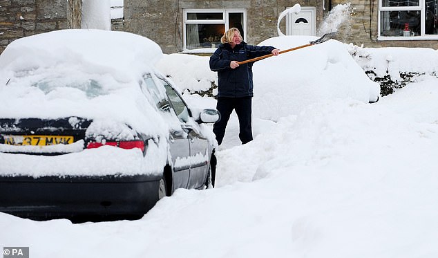 There was an unusually cold winter recorded in Europe 15 years ago. Pictured, a driver tries to dig a car out from under the snow in Allendale, Northumberland, January 5, 2010