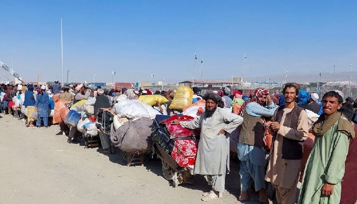 Afghan citizens wait with their belongings to cross into Afghanistan, after Pakistan gives the last warning to undocumented immigrants to leave at the Chaman Border Crossing on October 31, 2023.— Reuters