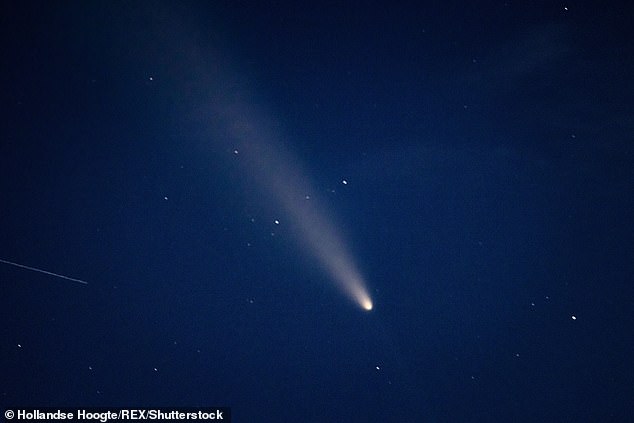 Experts suggest that 3I/ATLAS is more likely to be a comet due to the presence of a 'coma', a tail of gasses and ice produced by the heat from the sun. This would explain why the object appears to be so bright and rules out an alien origin. Pictured: Comet C/2023 A3 Tsuchinshan-Atlas is visible over the Netherlands in 2024