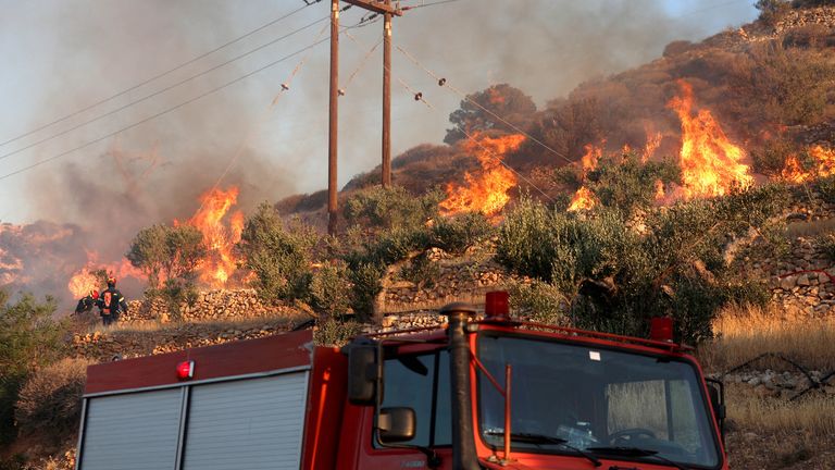 Firefighters try to extinguish a wildfire near Lerapetra, on the island of Crete, Greece.
Pic: Reuters