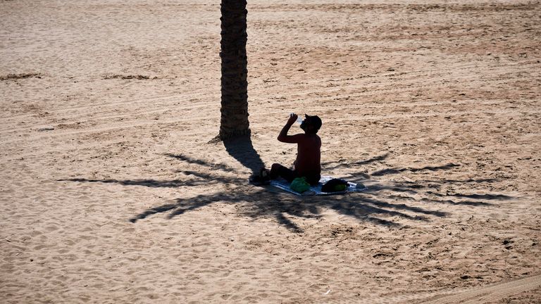 A man tries to keep cool in Barcelona. Pic: AP