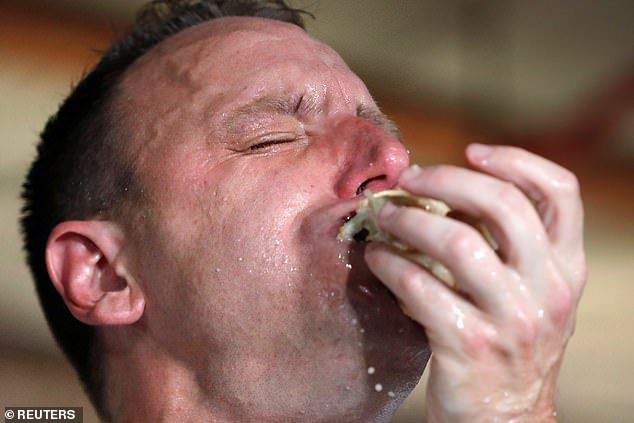 Pro eaters like Chestnut also dunk their hot dogs in water to make the buns easier to swallow