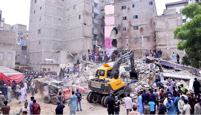 Heavy machinery is deployed for rescue operations after a residential building collapsed in Baghdadi, Lyari on July 4, 2025. — APP