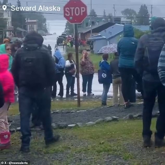 Thousand of Americans along Alaska's coastline raced to higher ground Wednesday, abandoning their homes after a major earthquake triggered a tsunami warning