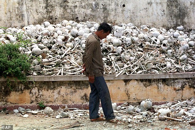 The UNESCO World Heritage Sites list now includes Cambodia's Killing Fields, the sites where millions of people who were killed by the Khmer Rouge between 1975 and 1979. Pictured: A man walks through one of the killing field sites outside of the capital Phnom Penh