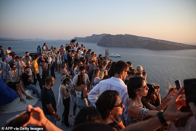 The growing numbers of tourists flocking to the volcanic island has continued to be a point of great contention for furious locals who have even threatened to leave the Greek island after officials told them to keep out of tourists' way