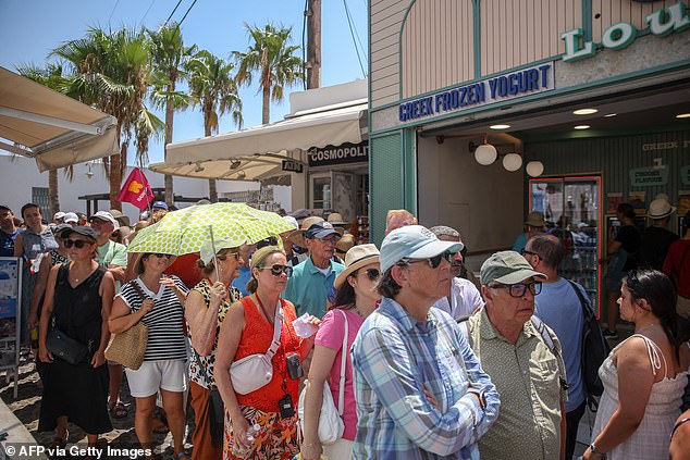 While Claire had hoped to 'explore the beaches and relax', she was left bitterly disappointed by 'jam packed streets that took ages to walk through', adding: 'It was also super hot with no shade anywhere. Pictured: tourists in Santorini on July 20, 2024