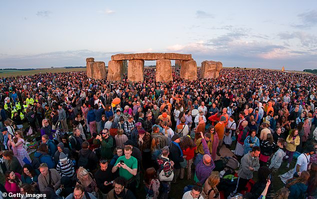 People have long been fascinated by Stonehenge due to its age, mystery, and impressive construction. Pictured: Visitors enjoy the sunrise during celebrations of the summer solstice at Stonehenge on June 21, 2025