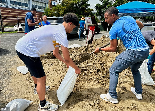 Volunteers filled sandbags for New Orleans residents on July 16, 2025, before heavy rains the Gulf Coast storm arrived